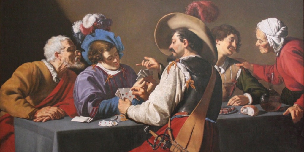 an image showing people playing cards