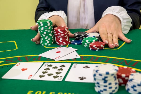Baccarat dealer pays out winnings