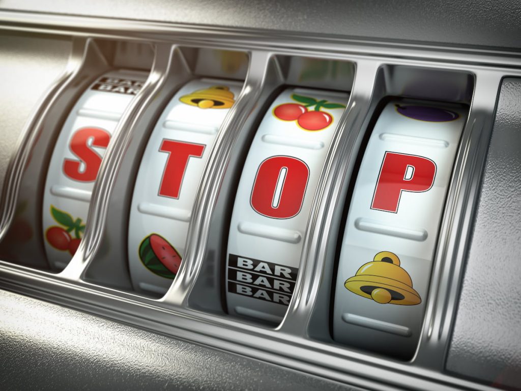 Slot machine displaying the word 'stop' on the reels.
