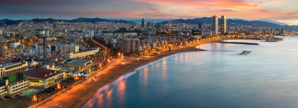 A view of the Barcelona coastline at dusk