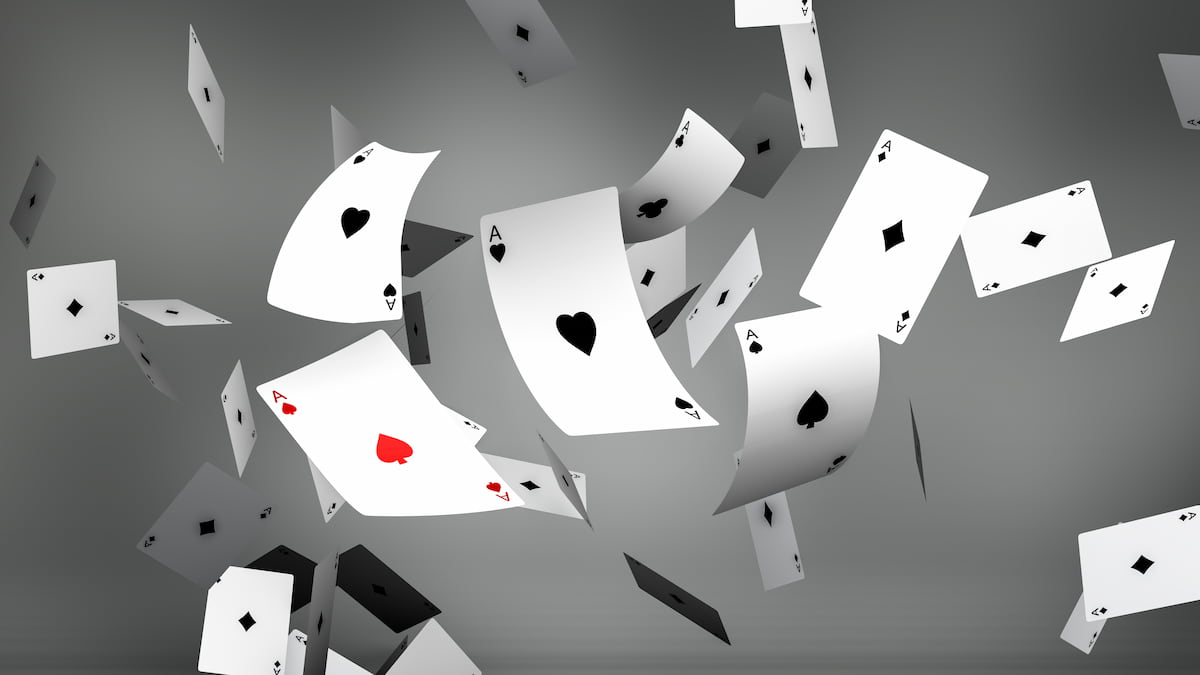 Bent cards falling from sky