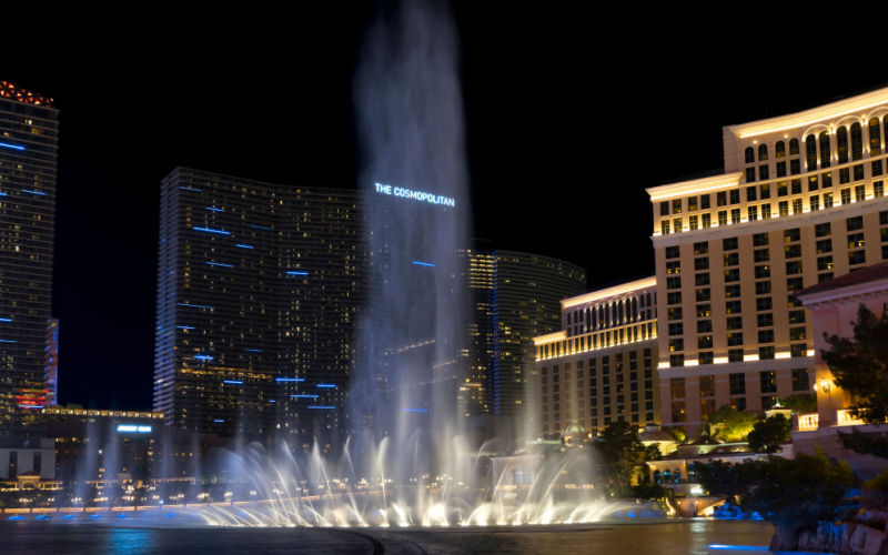 The fountains of The Bellagio in the foreground and The Cosmopolitan in the background