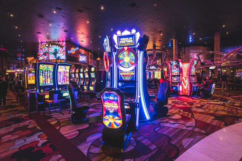 Land-based casino neon lights slot machine game gaming las vegas slots casino floor