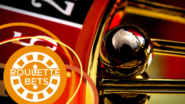Close-up of a ball in the number 5 pocket of the roulette wheel