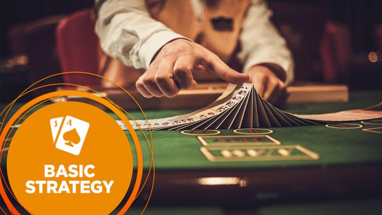 Dealer riffles cards at a blackjack table in a casino.