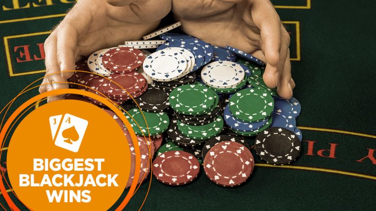 Dealer pushes blackjack chips towards the player.