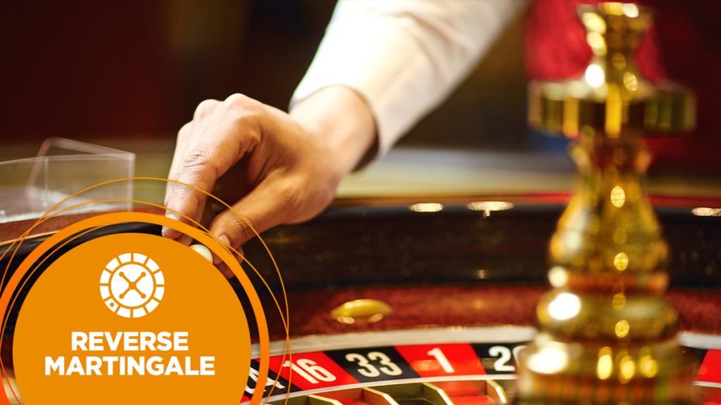 Croupier places a ball onto the roulette wheel.