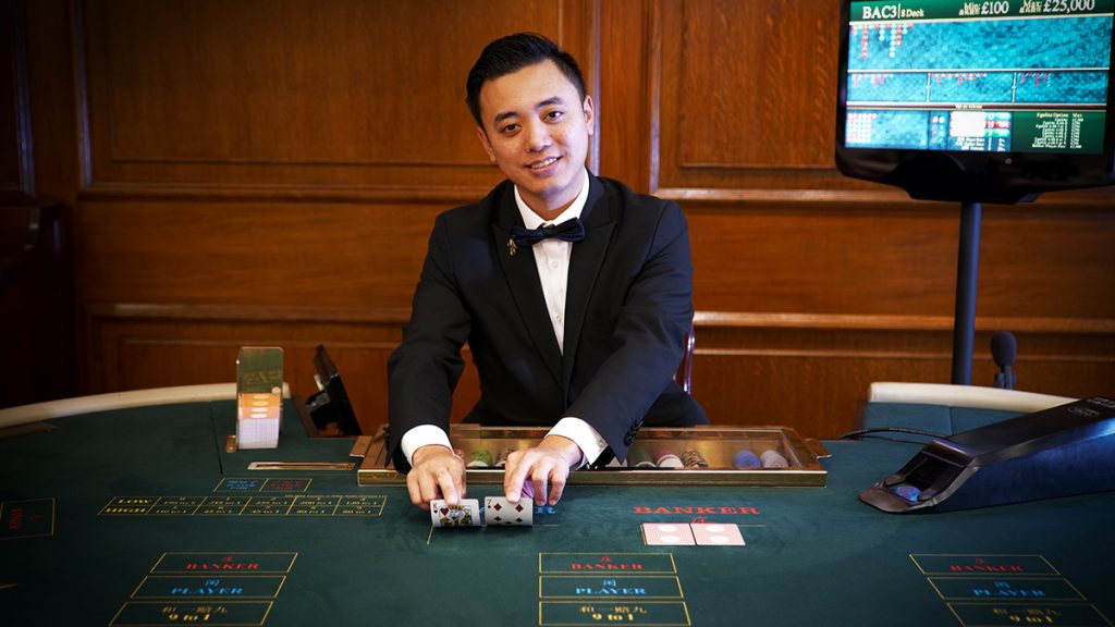 Live Dealer Exclusive Baccarat dealer at Les Ambassadeurs casino in London.