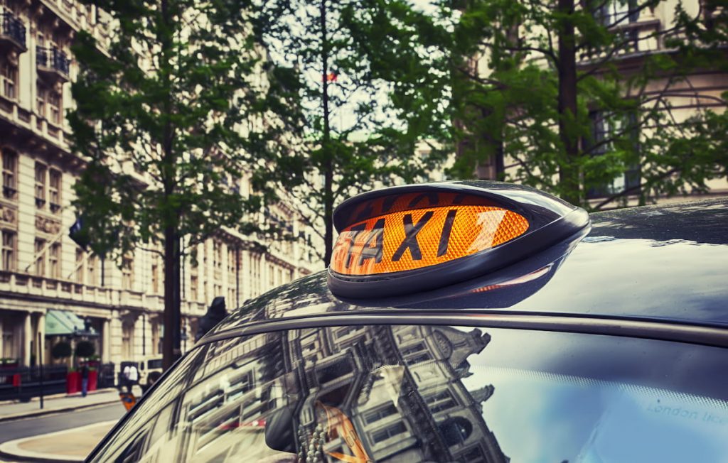 London taxi with sign lit.