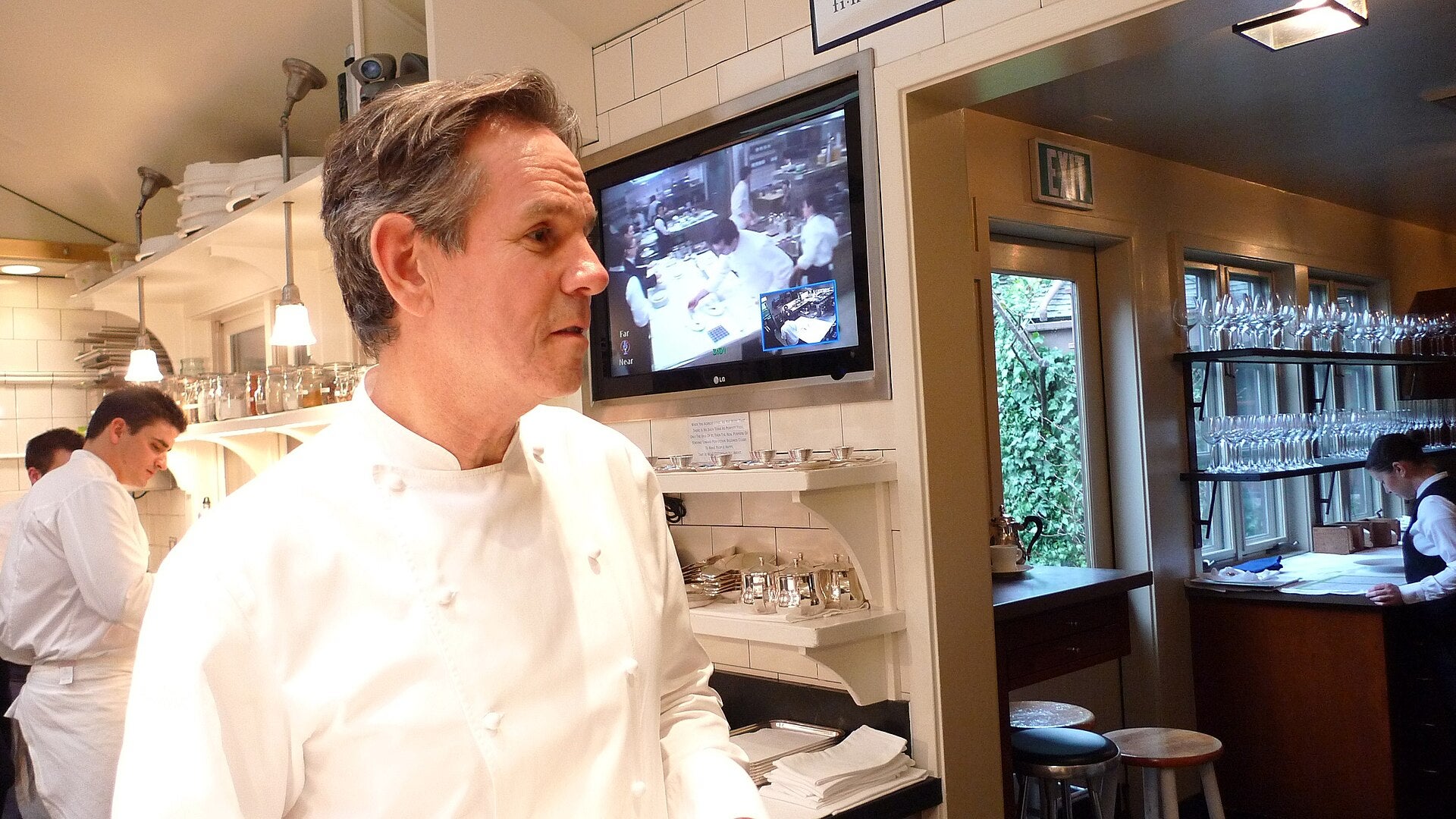 Thomas Keller Group Pays $2M in Bouchon Harassment Suit Chef Thomas Keller standing in a restaurant kitchen in his white chef's coat