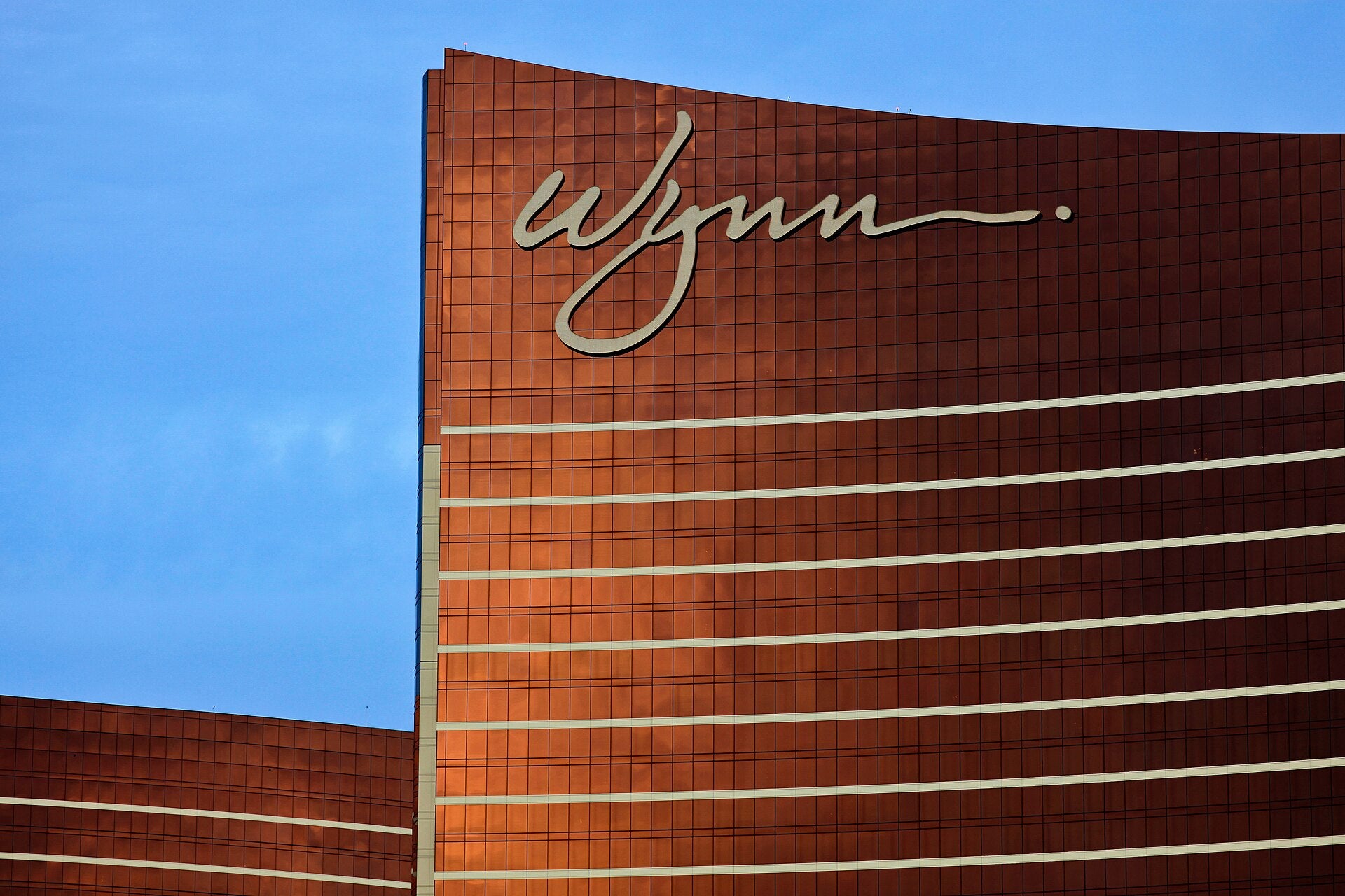 Wynn Las Vegas resort tower with curved copper facade, site of GGW's 2026 Patty Becker Award celebration