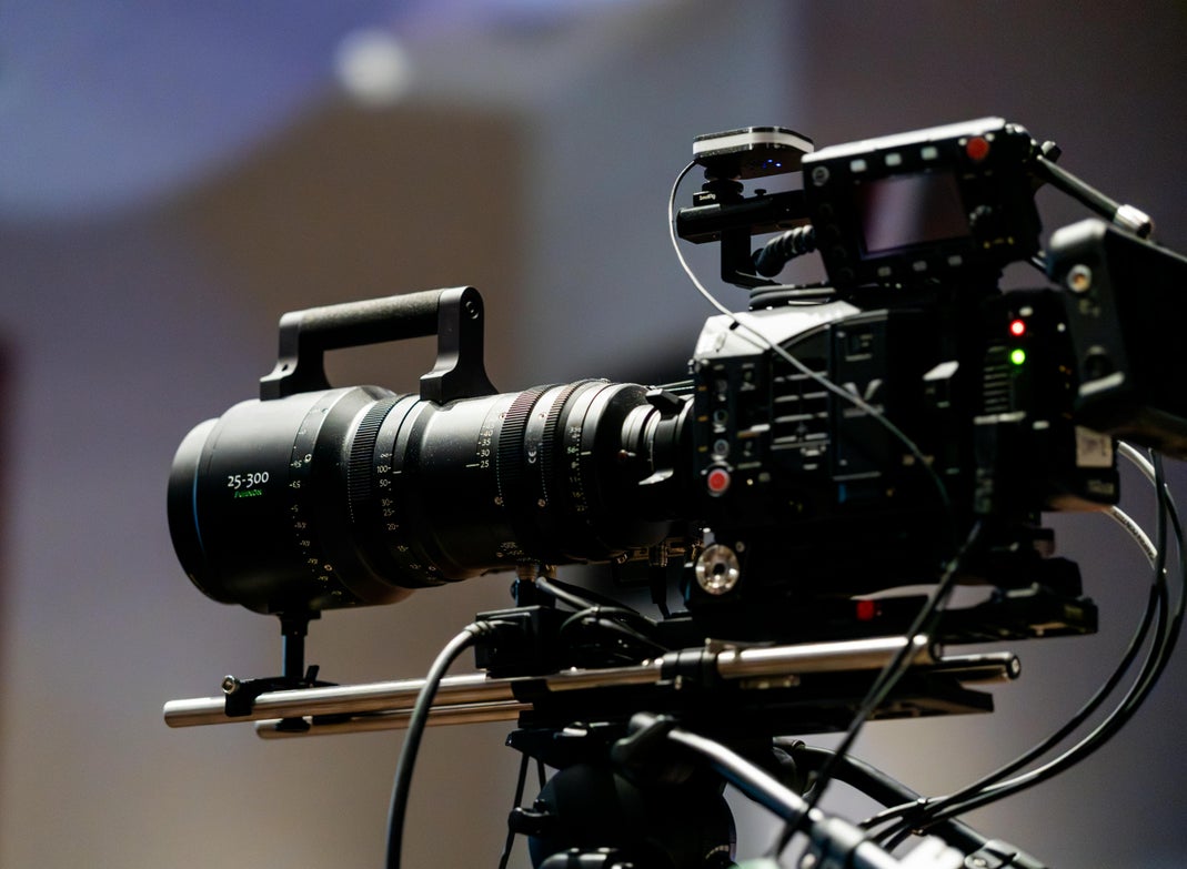 Vanderpump Rules: Lisa Las Vegas, New Bravo Series A close-up of a professional film camera with a Fujinon 25-300mm lens mounted on a rig, set against a blurred gray background