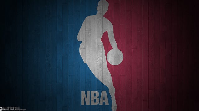NBA logo on a wood-textured background split in blue and red