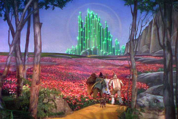 Wizard of Oz at Sphere Debuts New 4D Effects Sept. 25 Dorothy, Scarecrow, Tin Man, and Toto approach the Emerald City through a field of poppies in The Wizard of Oz