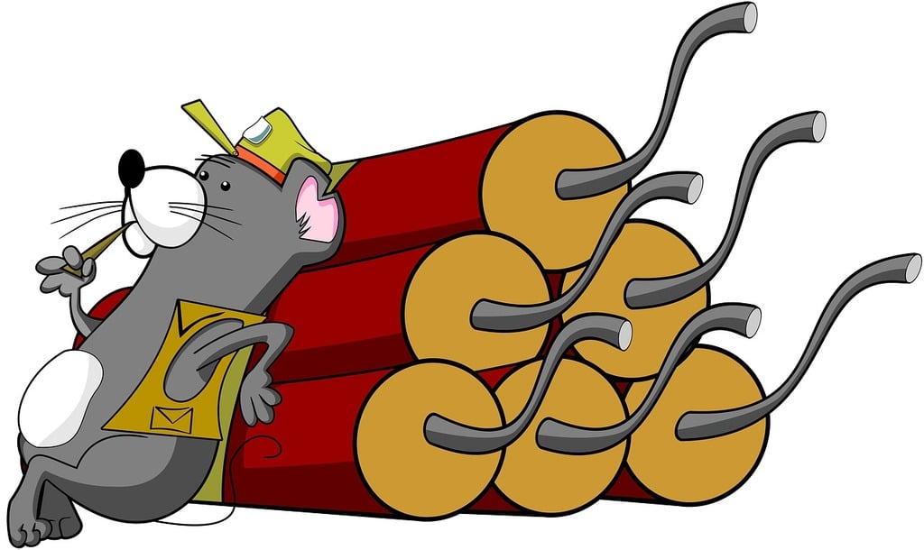 A mouse leaning over dynamite sticks
