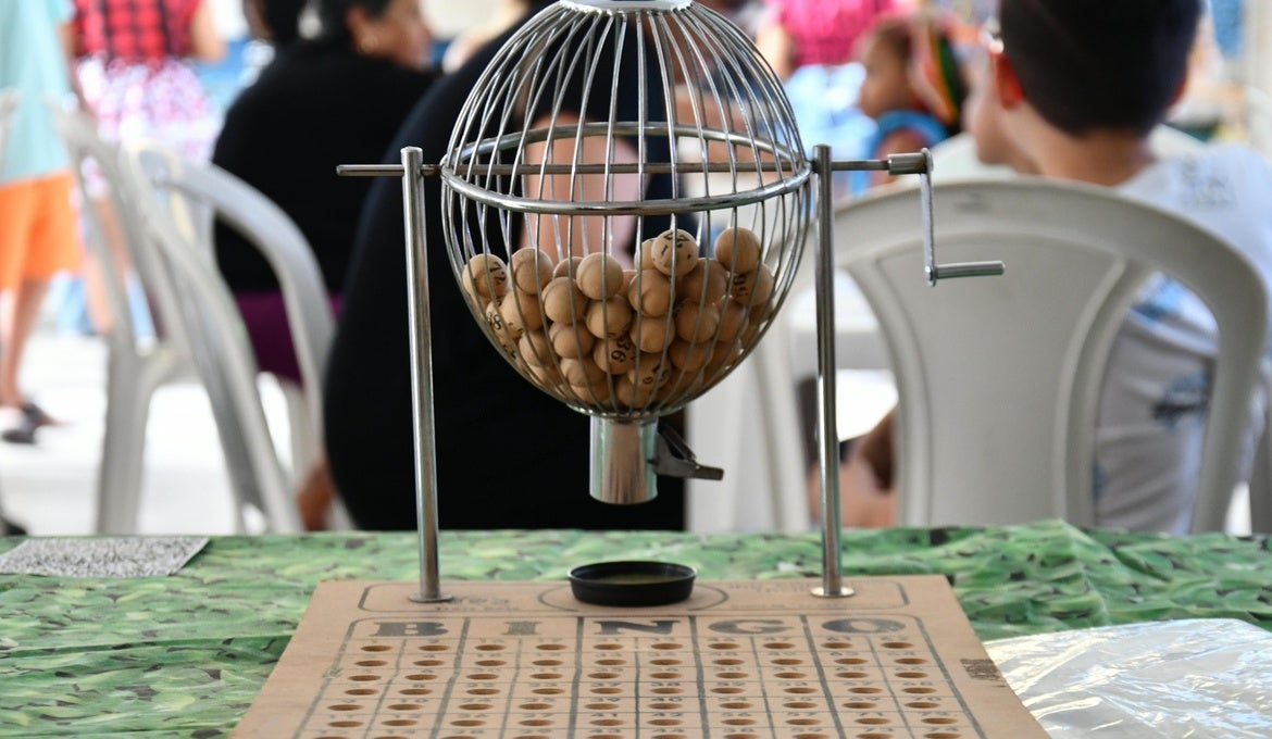 An image of a bingo machine with numbered balls