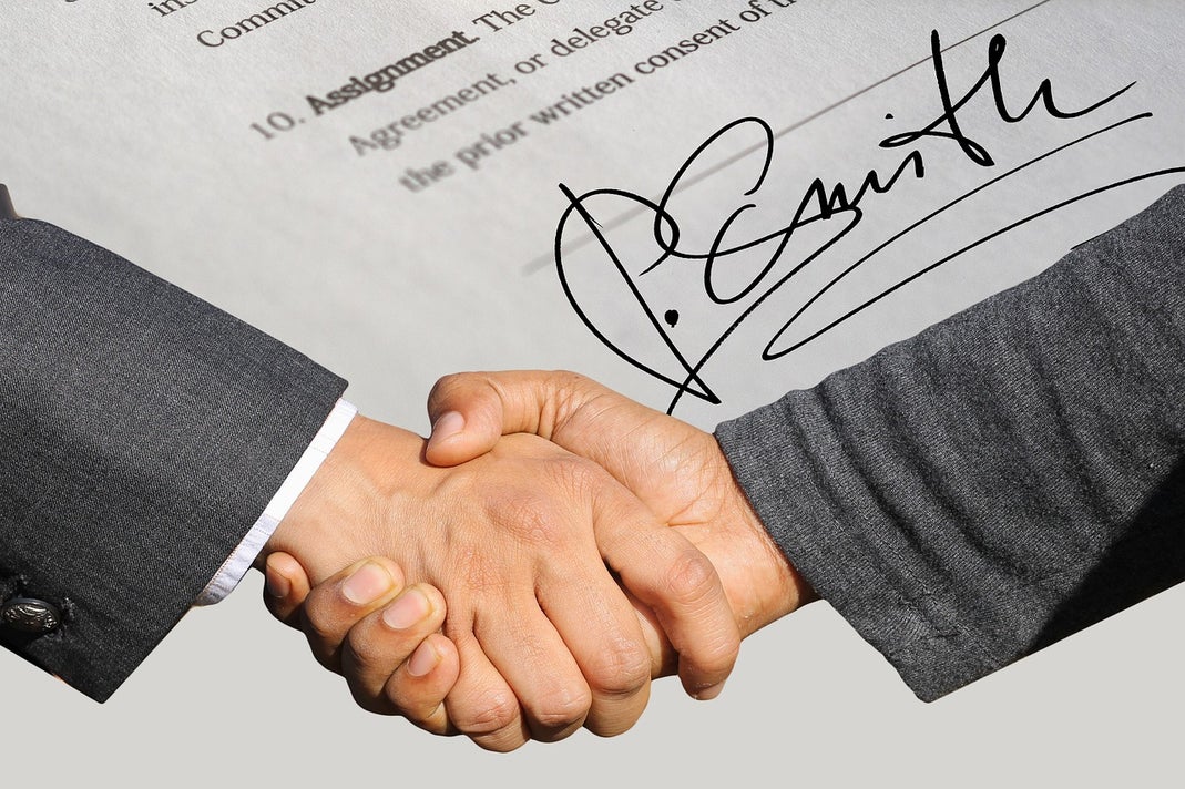 Two businessmen shaking hands in agreement
