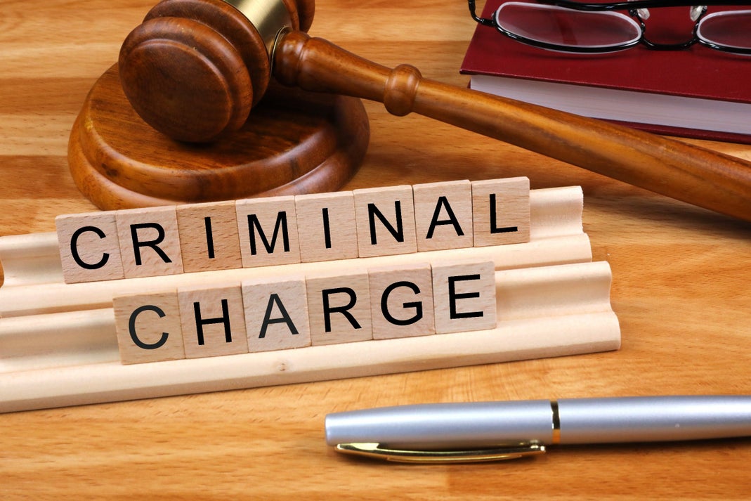 Blocks Spelling Out CRIMINAL CHARGE