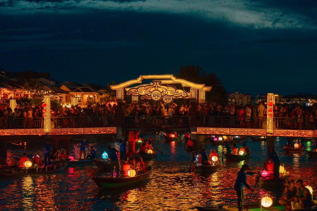Lantern boats on the river near An Hoi Bridge in Hoi An Ancient Town, Vietnam at night