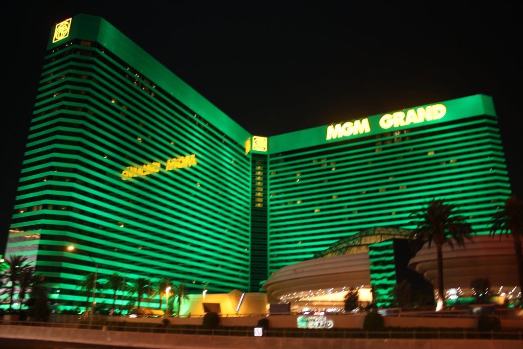 MGM Grand hotel and casino illuminated in green on the Las Vegas Strip at night