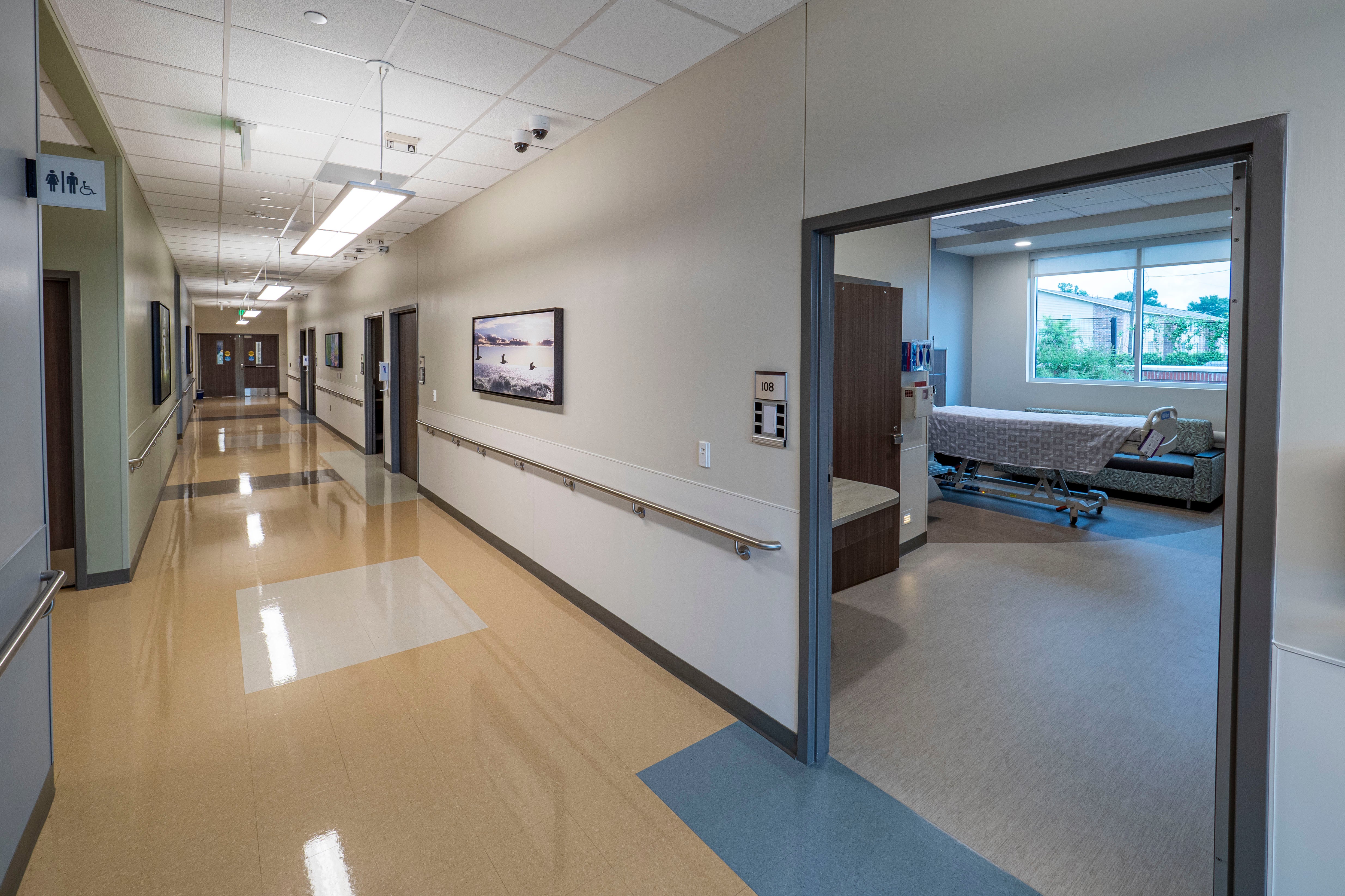 Hospital hallway leading to a patient room with a bed, similar to planned Nevada Children's Hospital facilities