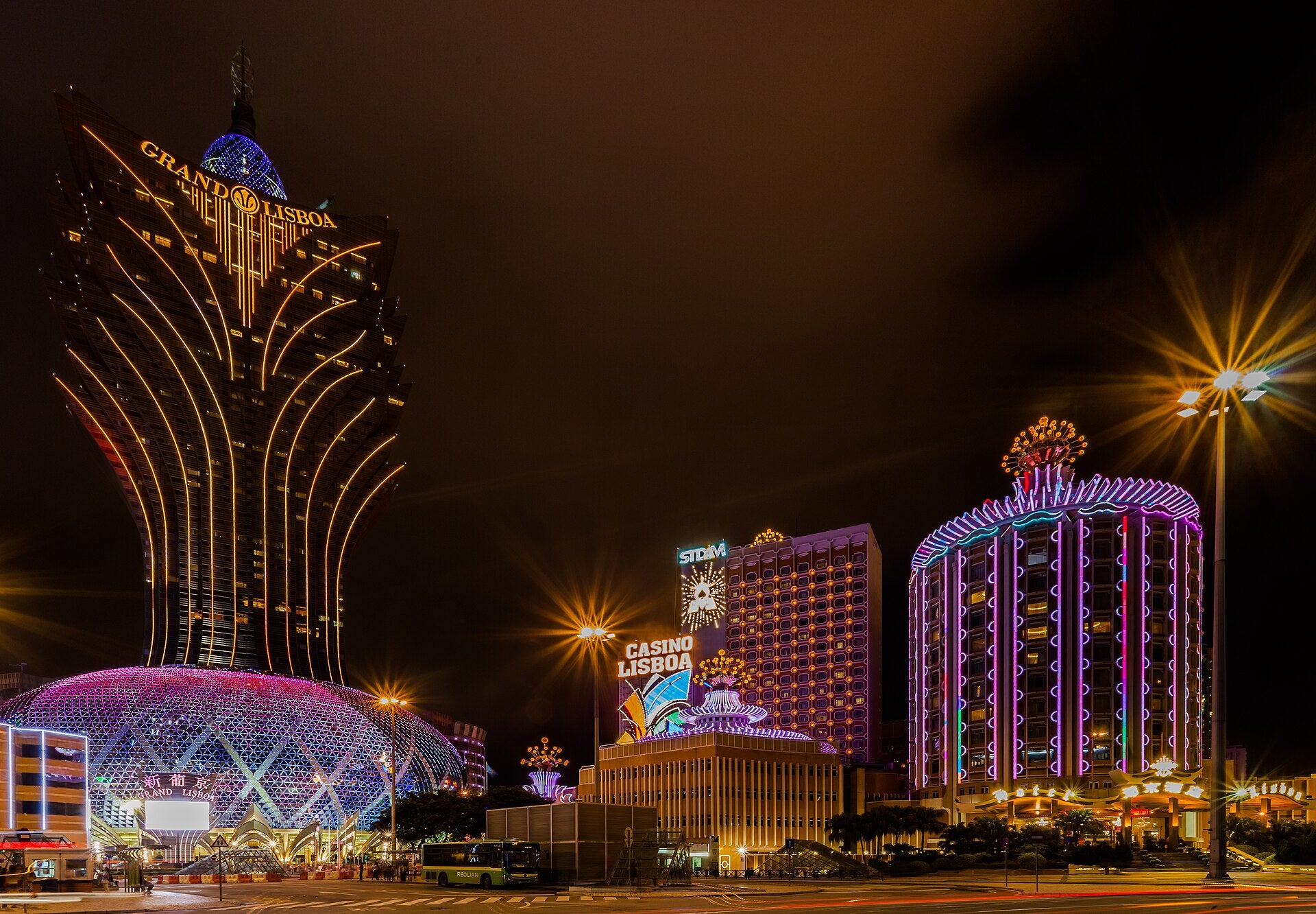 Macau Golden Week Arrivals Hit Records as GGR Lags The Grand Lisboa tower, Casino Lisboa and Hotel Lisboa lit up at night in Macau
