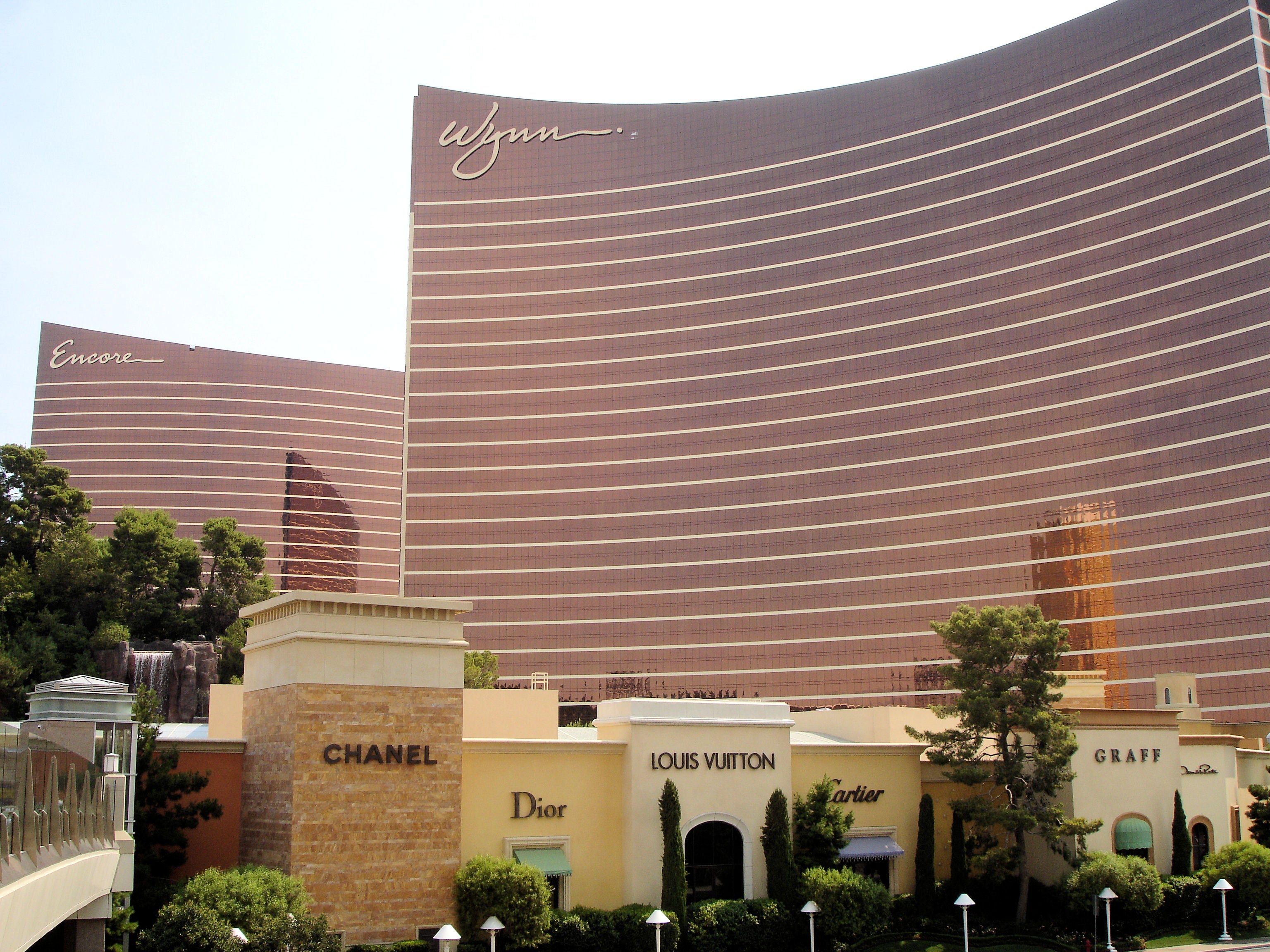 Wynn and Encore hotel towers in Las Vegas behind Chanel, Louis Vuitton, Dior, Cartier and Graff luxury stores
