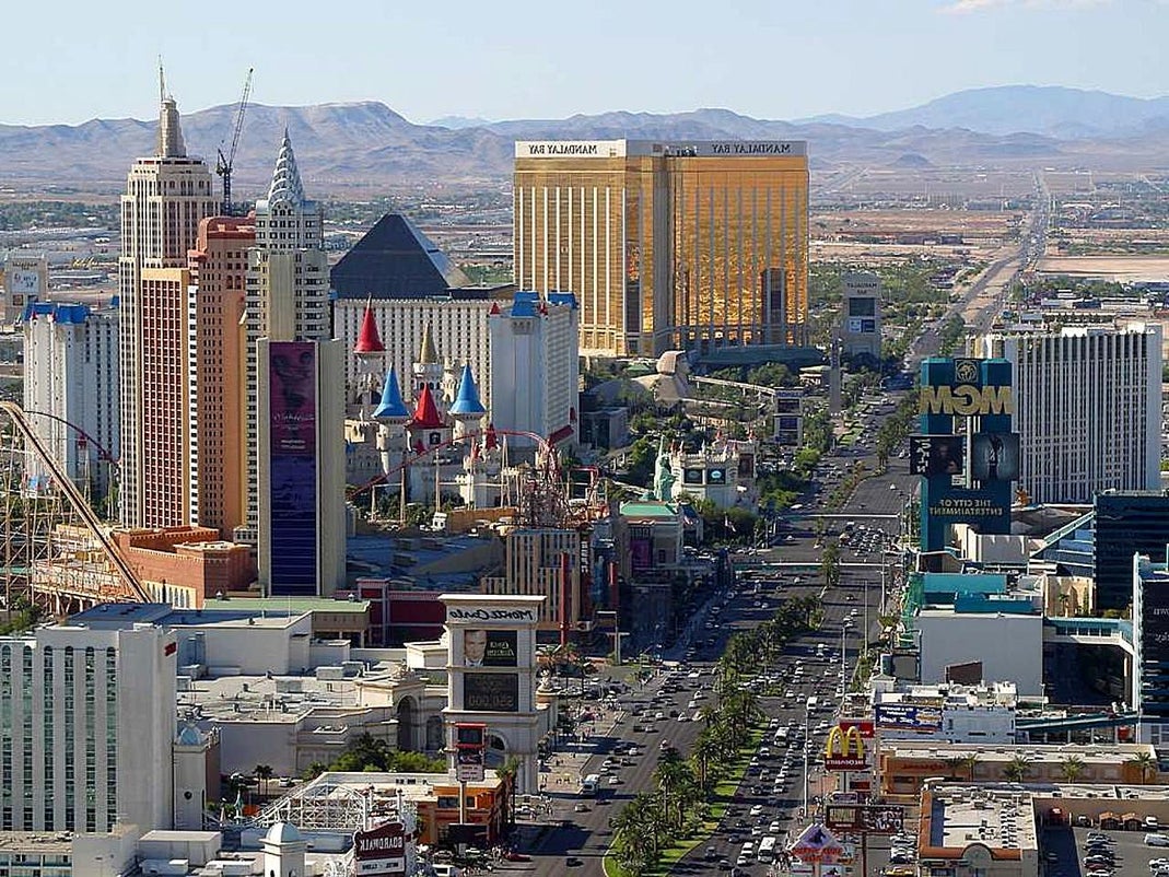 Aerial view of the Las Vegas Strip showing hotels and casinos including Mandalay Bay, Excalibur, and MGM Grand