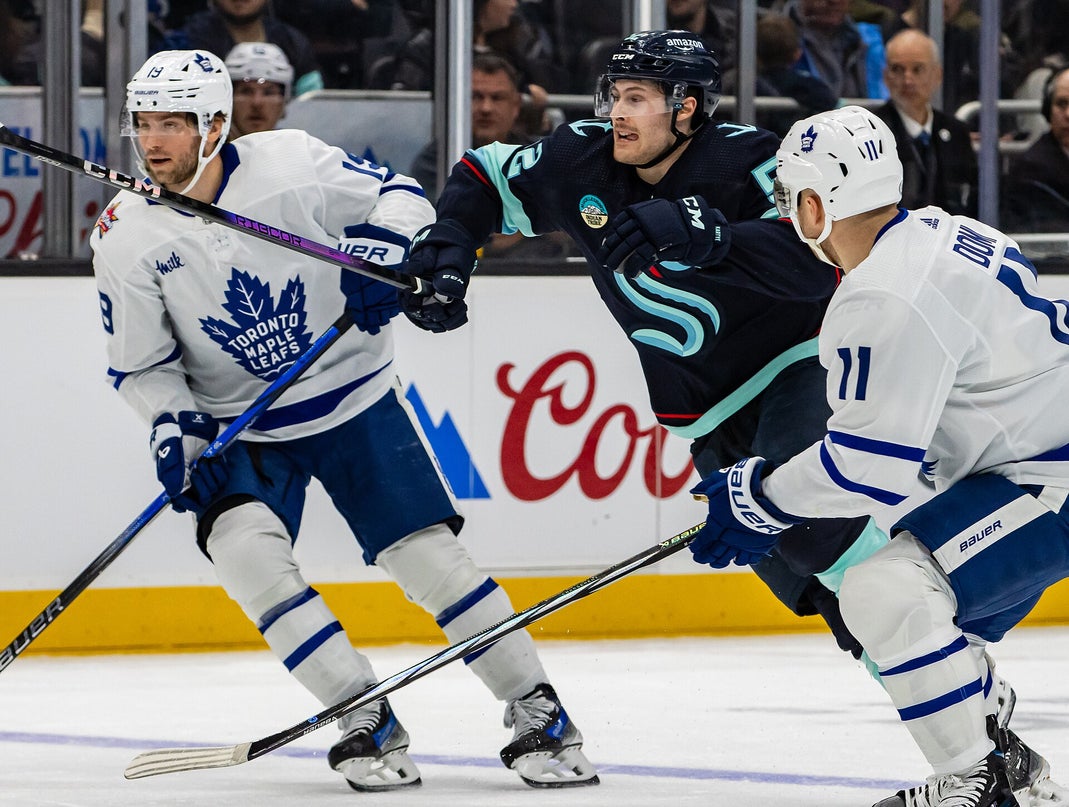 Toronto Maple Leafs vs. Seattle Kraken – January 2024 Toronto Maple Leafs players Calle Järnkrok and Max Domi in action against Seattle Kraken's Tye Kartye during an NHL game in January 2024