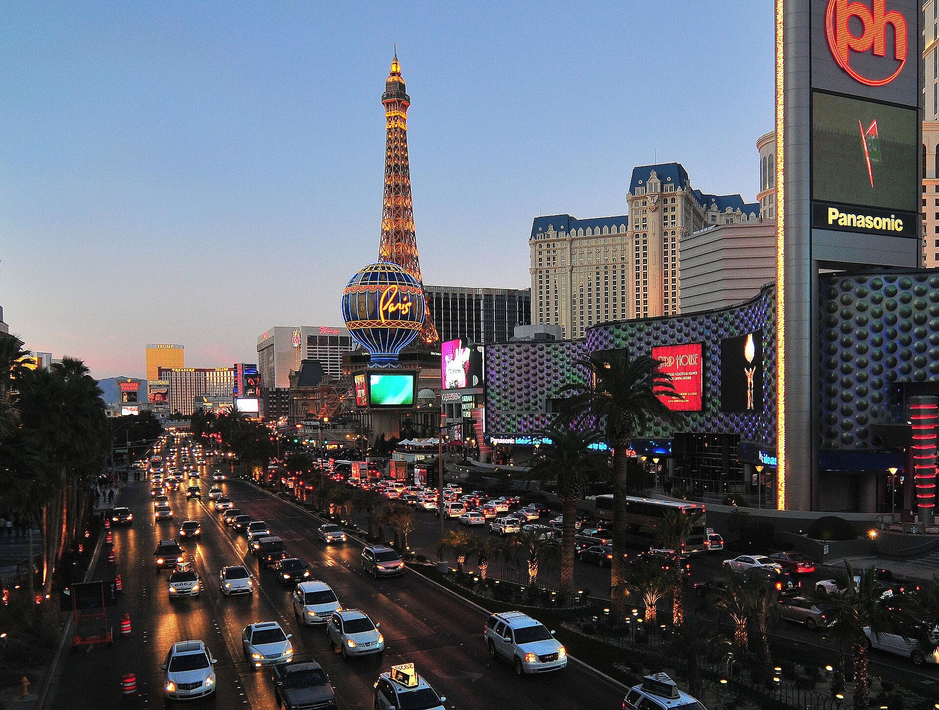 Las Vegas Strip Gaming Revenue Jumps 13.2% in May 2026 Las Vegas Strip at sunset with traffic and lit-up casino resorts along the road