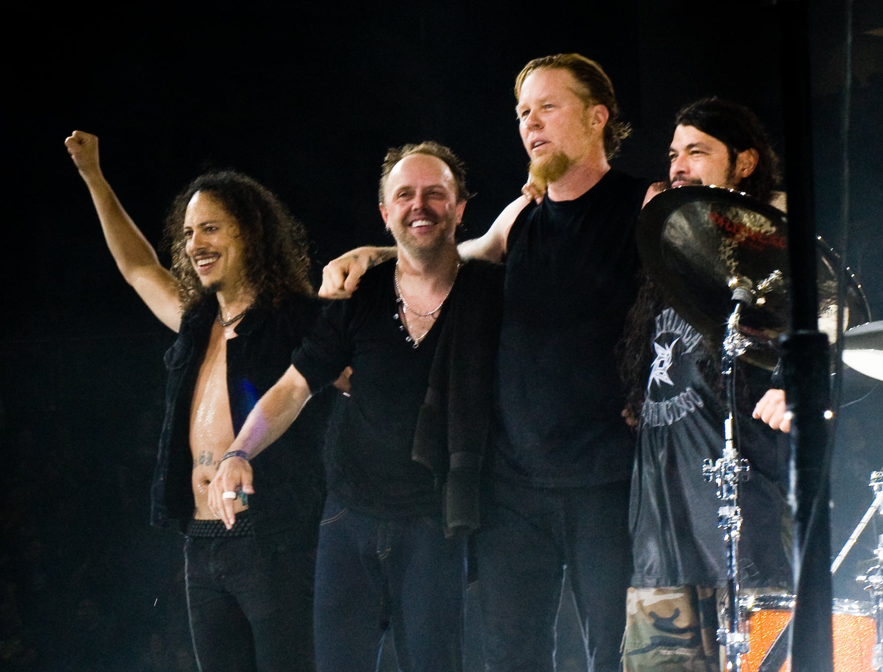 Metallica Sphere Residency: Weekend 2 Shows Oct. 8 and 10 Metallica's four members stand arm in arm on stage after a concert at The O2 Arena in London in 2008