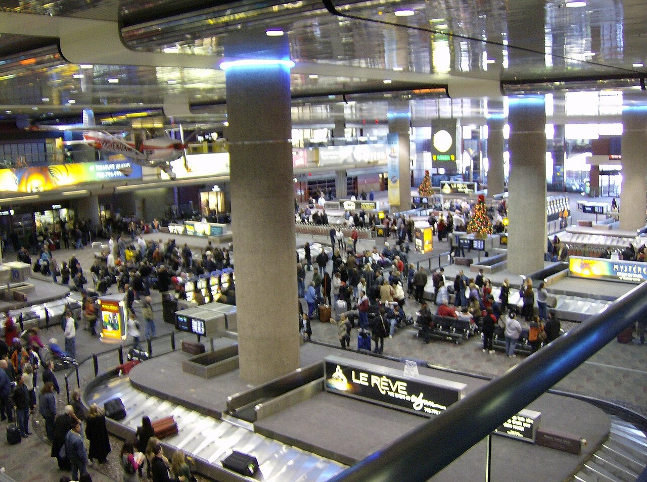 Baggage claim area in Terminal 1 of Harry Reid International Airport in Paradise, Nevada with travelers waiting for luggage