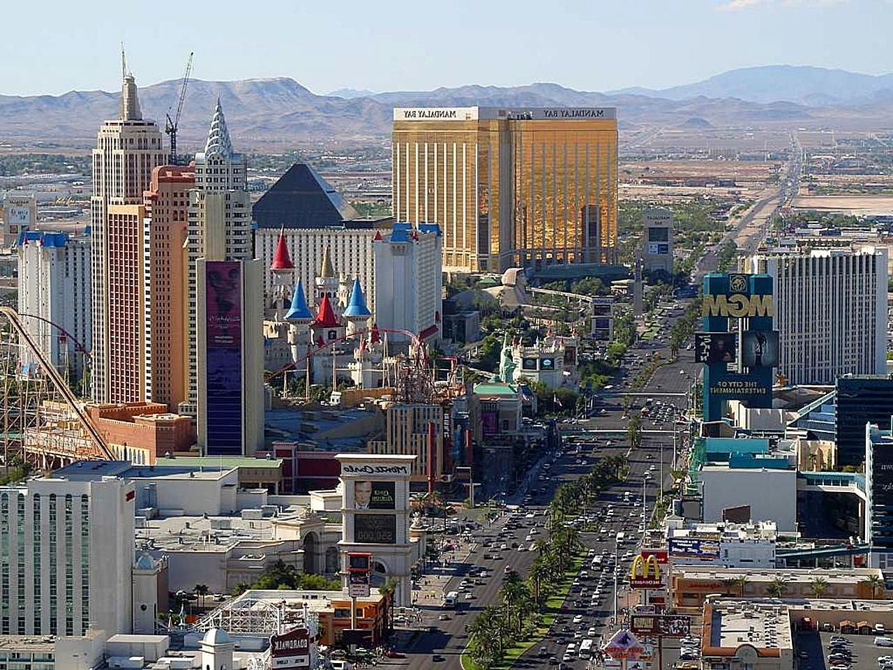 Aerial view of the Las Vegas Strip showing hotels and casinos including Mandalay Bay, Excalibur, and MGM Grand