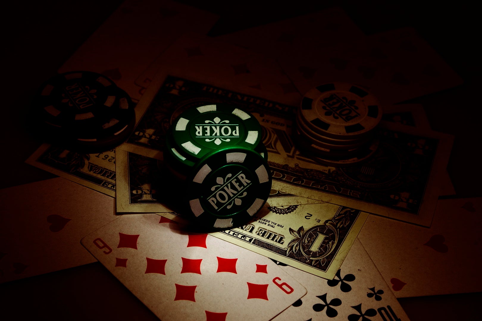 Singapore Court Sentences 6 Malaysians for Poker Heist Poker chips, cash, and playing cards representing the high-stakes Singapore poker game targeted in the robbery