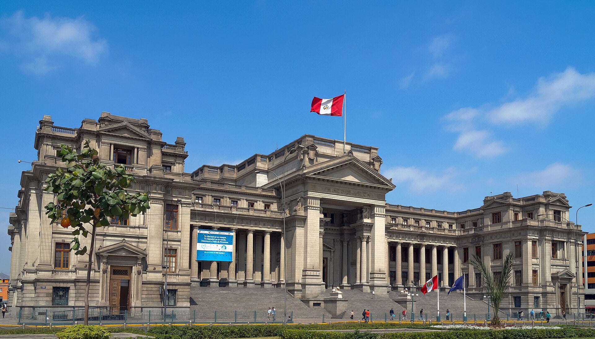 Peru Betting Tax Hike Proposed as Chile Collects VAT Palace of Justice in Lima, Peru, with the Peruvian flag flying above its neoclassical facade under a blue sky