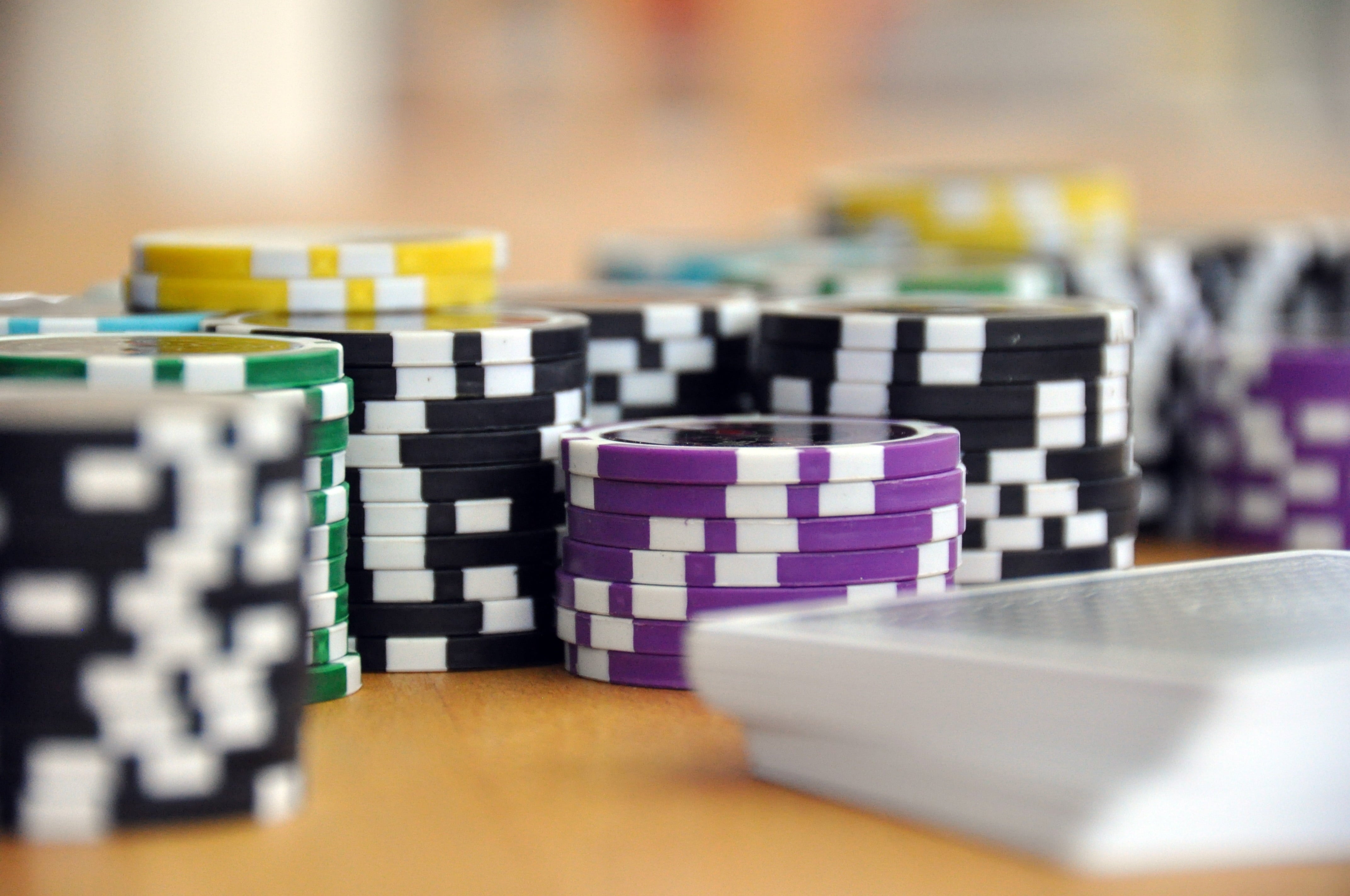 Fanatics Casino Launches in Ontario as 50th Operator Stacks of colorful poker chips on a table, representing Ontario's crowded iGaming and casino market