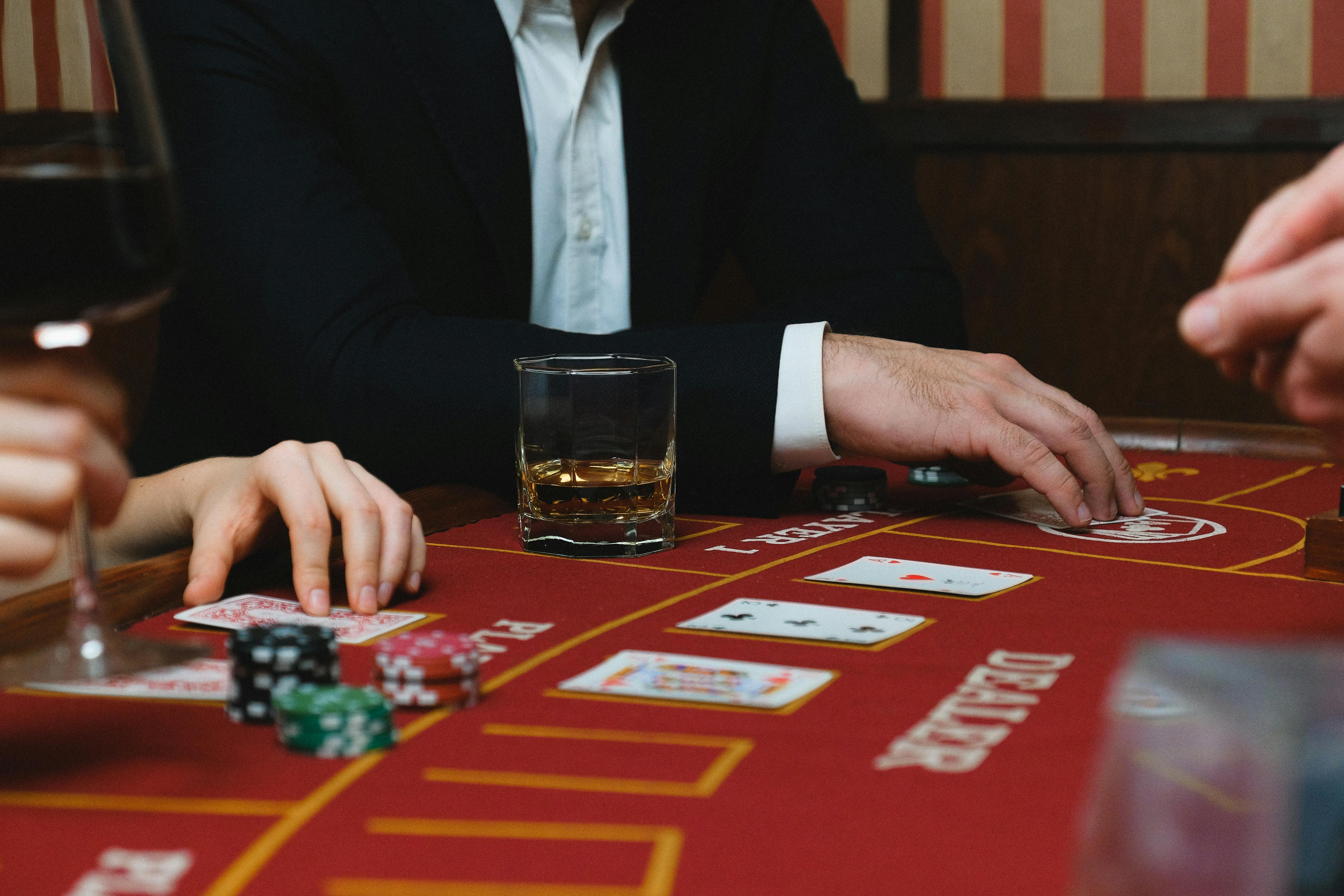 2026 WSOP Results: Bracelets, Winners & Highlights Close-up of a poker game with cards, chips, and players inside a casino setting