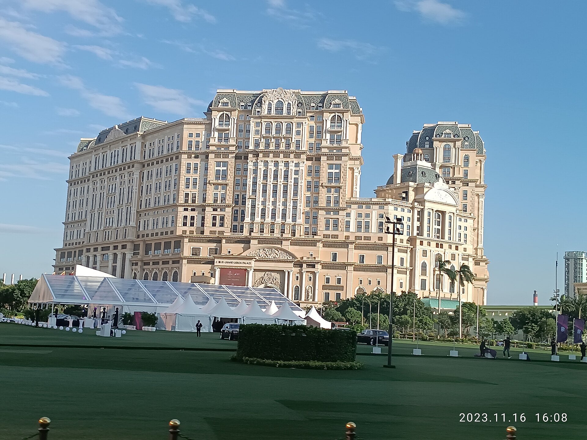 Fitch Downgrades SJM Holdings to B+ on Market Share Loss Grand Lisboa Palace hotel exterior view from Cotai, Macau, November 2023
