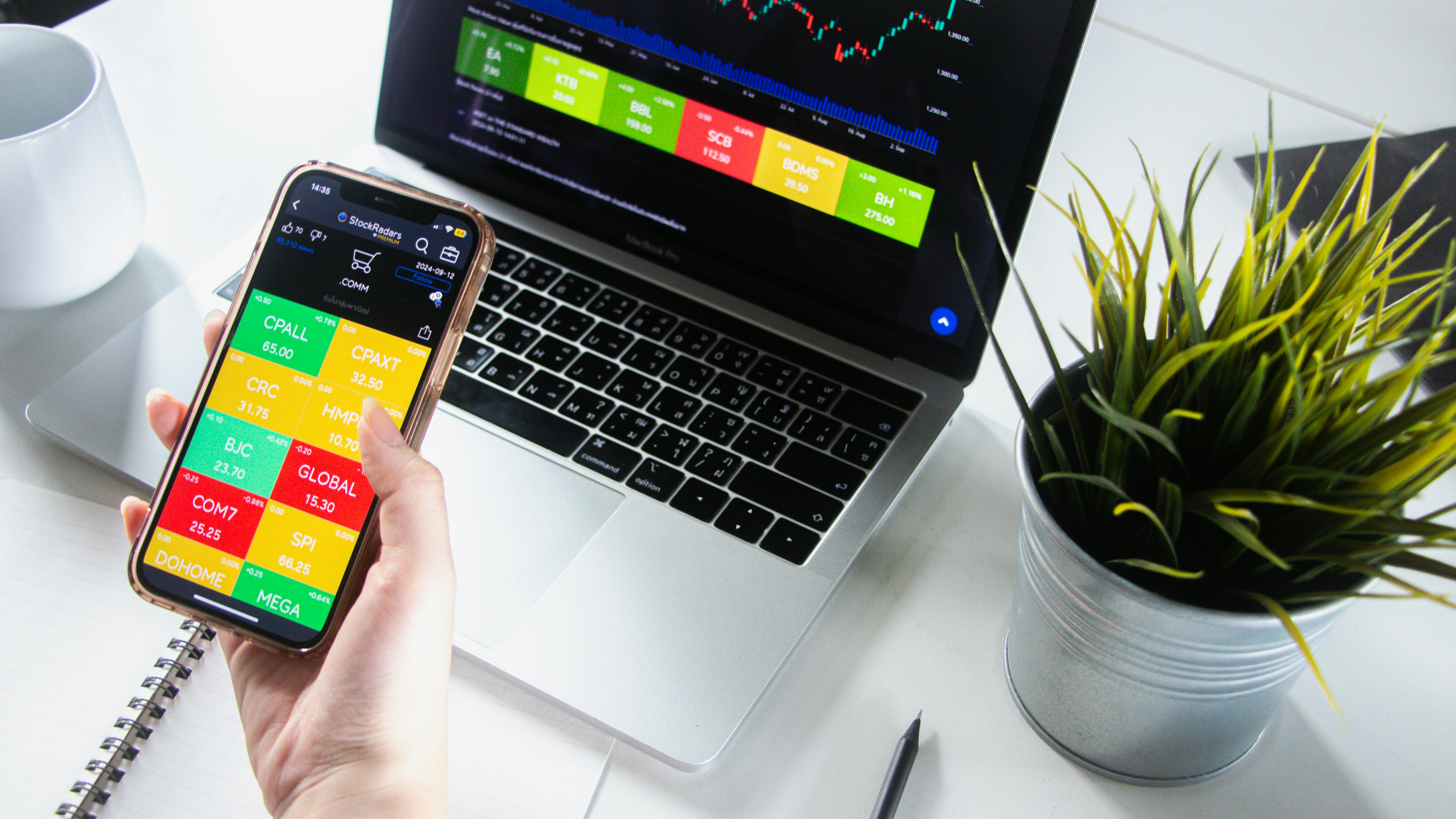 Stock Market Analysis on Mobile and Laptop - pexels.com A Person Checking the Stock Market