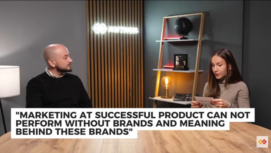 An image of two iGaming leaders discussing statements on cards