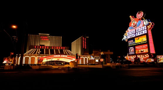 Circus Circus Hotel and Casino illuminated at night with neon clown sign on the Las Vegas Strip