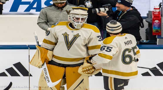 Vegas Golden Knights goalie Jiří Patera and defenseman Dysin Mayo during warmups at the 2024 NHL Winter Classic against the Seattle Kraken