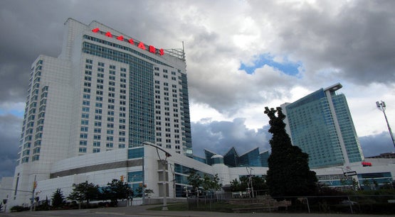 Exterior view of Caesars Windsor hotel and casino building under cloudy skies