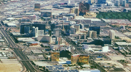 Aerial view of the Las Vegas Strip in Nevada showing Mandalay Bay, the Luxor pyramid, and surrounding resort casinos