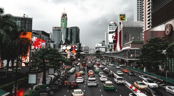 Bangkok City Street, Thailand Heavy traffic on a busy Bangkok city street with skyscrapers and billboards in the background