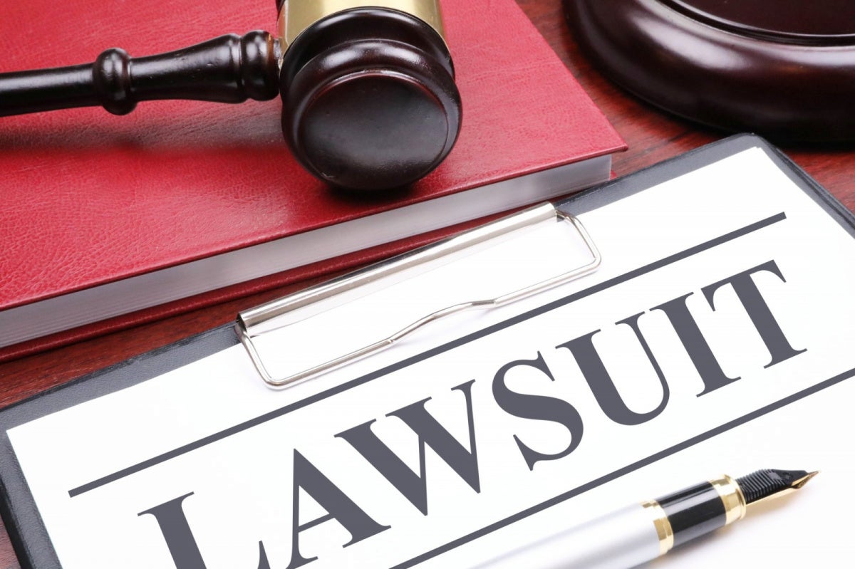 Sphere-Linked MSG Sues WIRED Over Celebrity Database Clipboard with LAWSUIT document, gavel, and pen representing MSG's defamation lawsuit against WIRED
