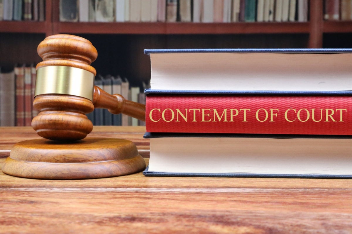 Vegas Dave Held in Contempt, Ordered to Surrender Assets Gavel and law books labeled contempt of court, representing Vegas Dave's ruling