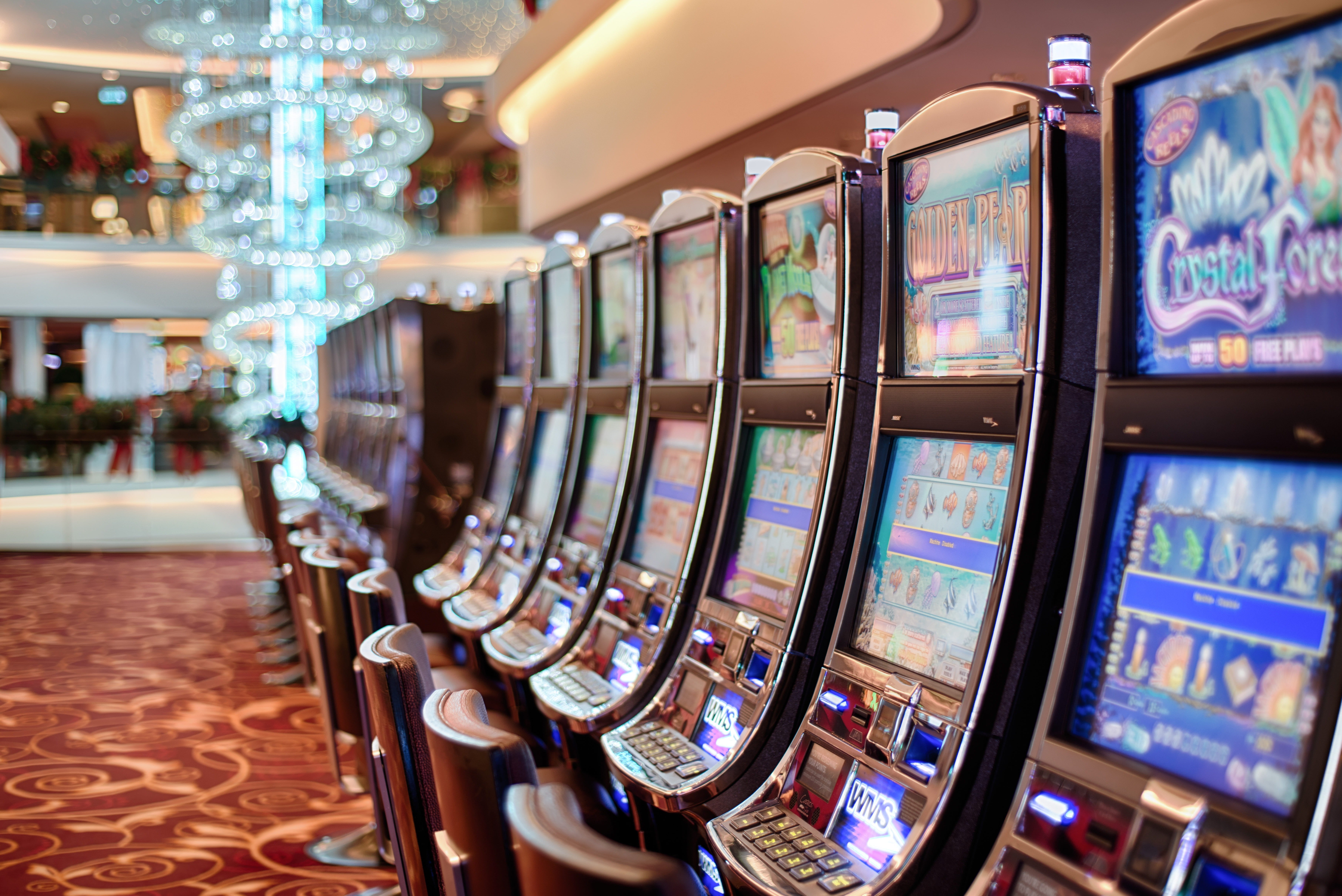 Universal Entertainment Forms Nevada Gaming Unit UDN Row of casino slot machines representing the gaming equipment Universal Entertainment's UDN Gaming will manufacture in Nevada