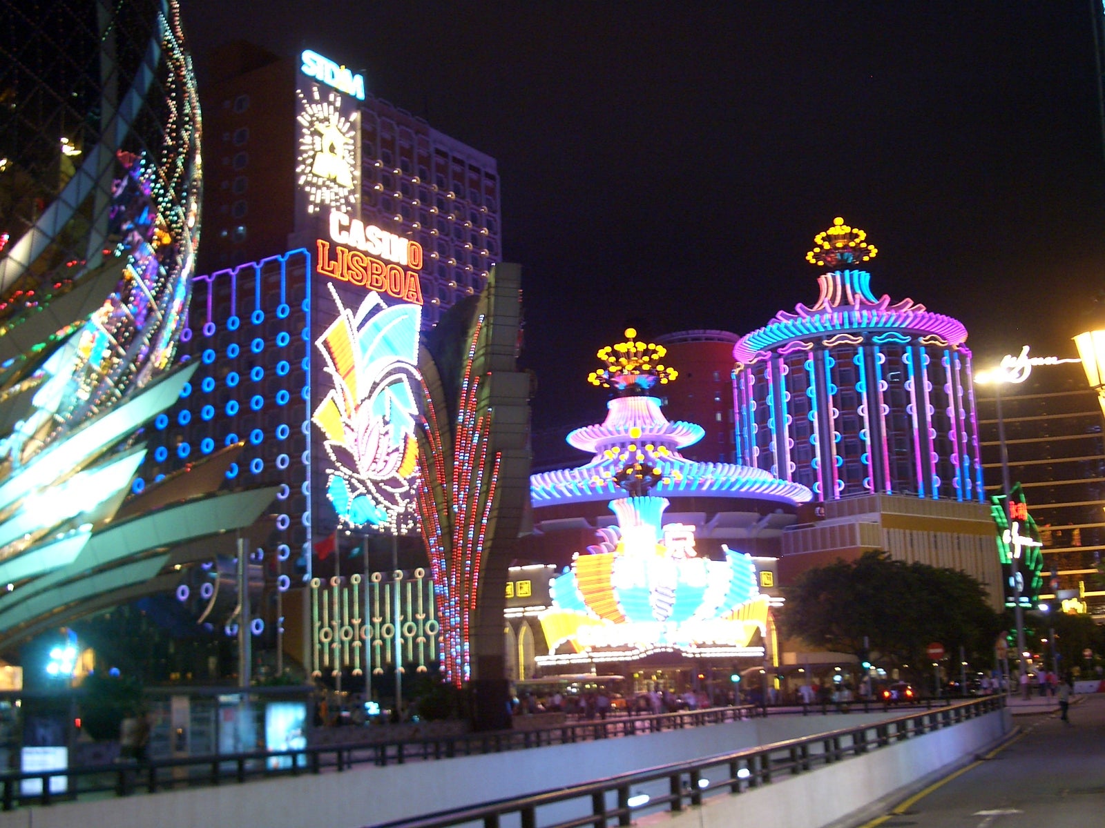 Casino Lisboa and the Grand Lisboa lit up with neon lights at night in Macau