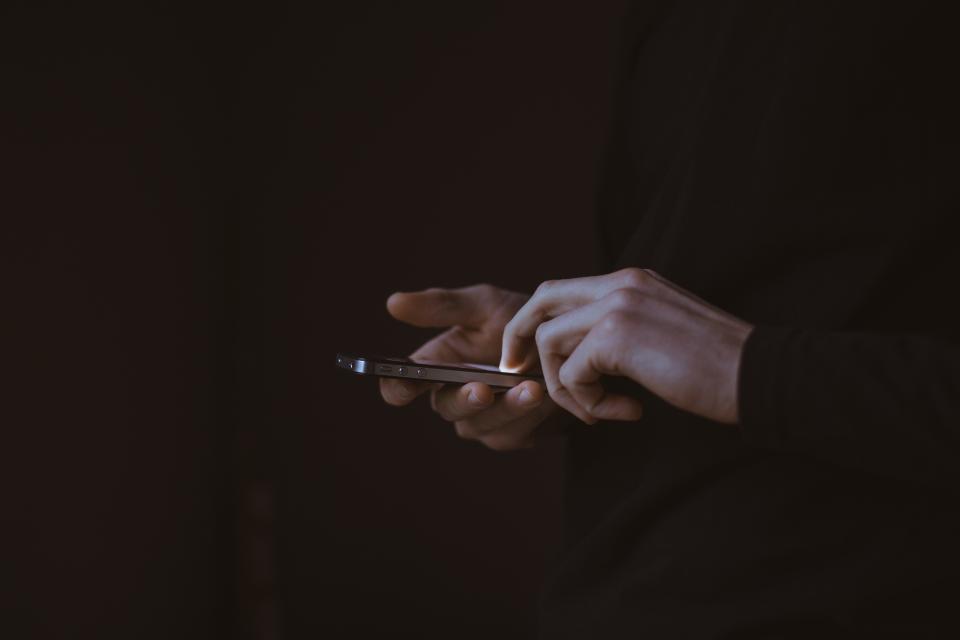 A Person Scrolling on Their Phone